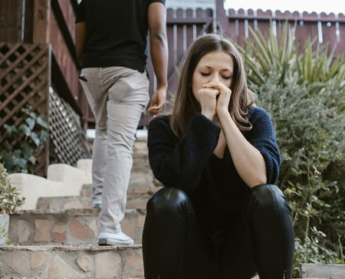 a couple arguing and walking away