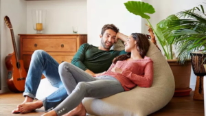 a couple chatting on a beanbag